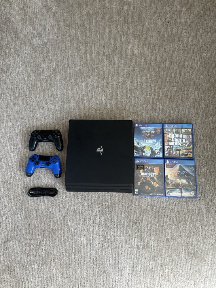 Sony PlayStation 4 Pro PS4 - 2 controllers 4 games 1 Power Cord With  GTA 5