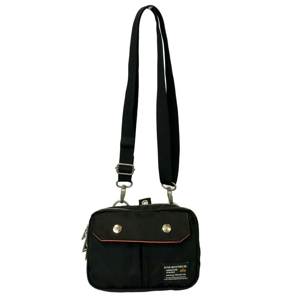 Alpha men's shoulder bag with scratches, dirt, and clasp damage