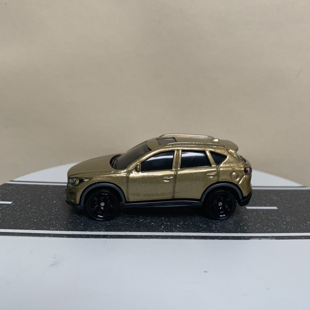 2023 Matchbox 70 Years 51/100 Mazda CX-5 SUV Gold Mtflk w/Black 5 Spoke Wheels