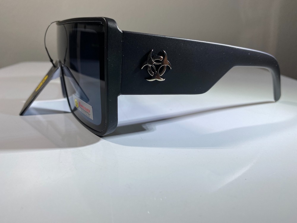 Futuristic unisex sunglasses with black frame and smoke black lenses