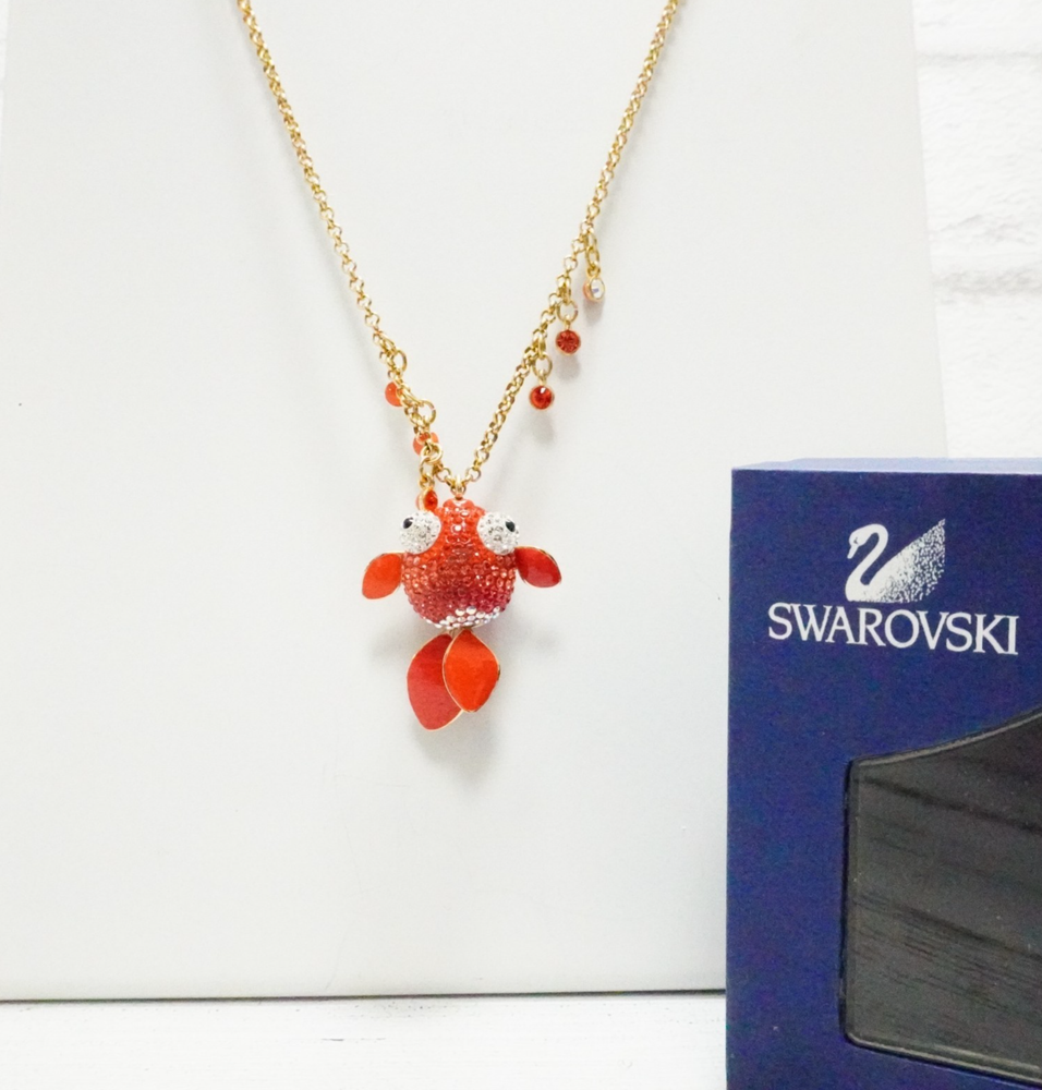 Swarovski goldfish pendant necklace with gold tone chain and red crystal in box