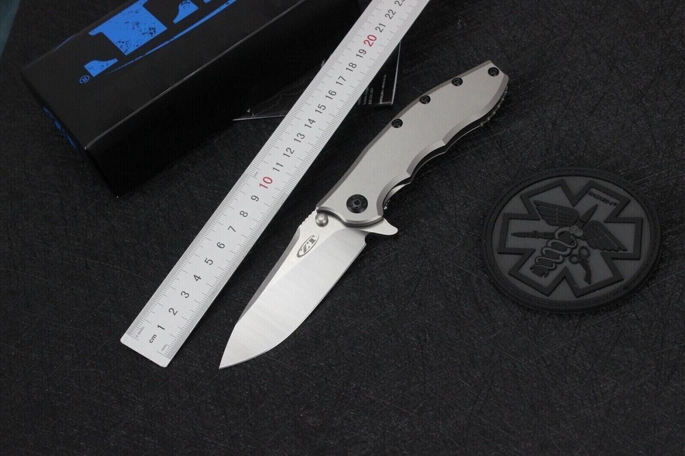Zero Tolerance 0562TI Folding Pocket Knife with Gray Titanium Handle  