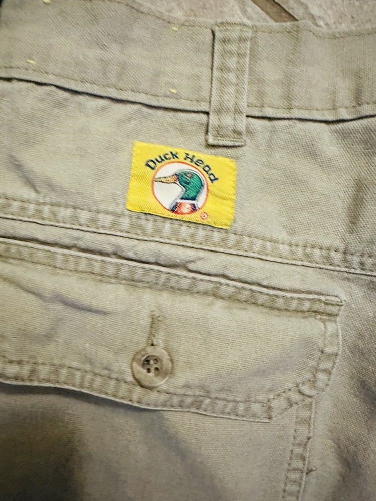 Vintage Duck Head khaki shorts with button-flap back pockets.