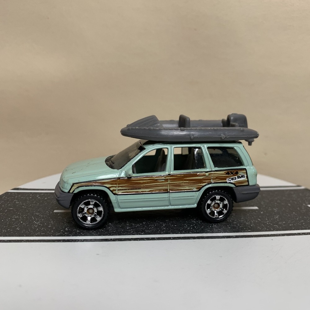 Matchbox 1999-2004 Jeep Grand Cherokee WJ 4x4 Mint Green/Woody w/Raft Boat