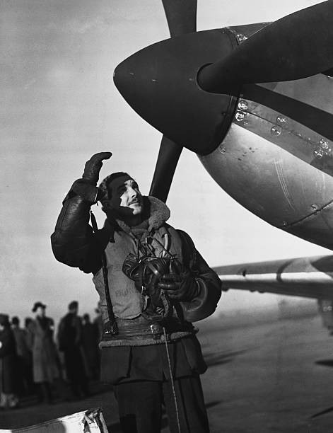 Royal Air Force pilot prepares to climb into his Spitfire on a Bri- Old Photo
