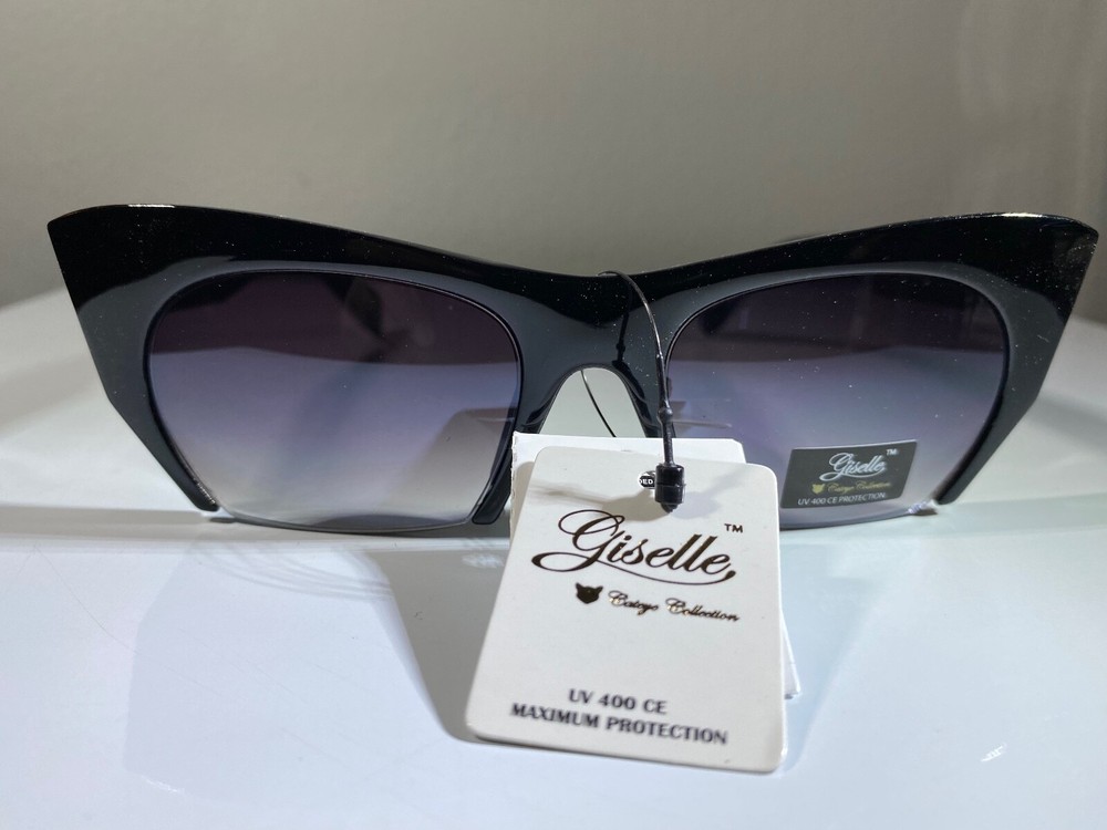 Women's black cat eye sunglasses with purple lenses  