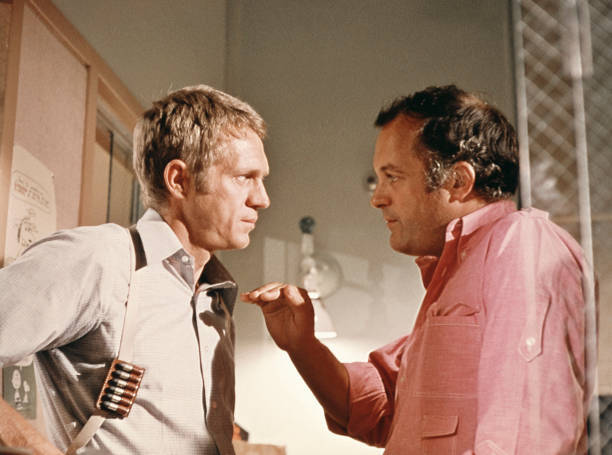 Steve McQueen director Peter Yates discuss scene during filming Bu- Old Photo