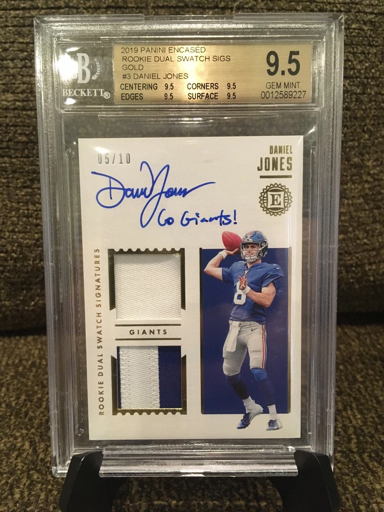 2019 Panini Encased - Rookie Dual Swatch Signatures Gold #RSS-DJD Daniel Jones /10 (AU, MEM, RC)