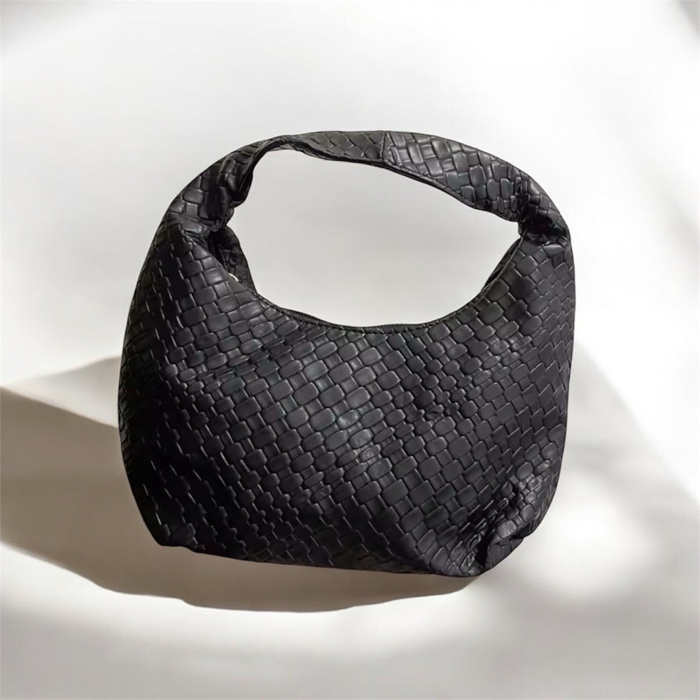 Black woven hobo shoulder bag with a minimalist slouchy silhouette