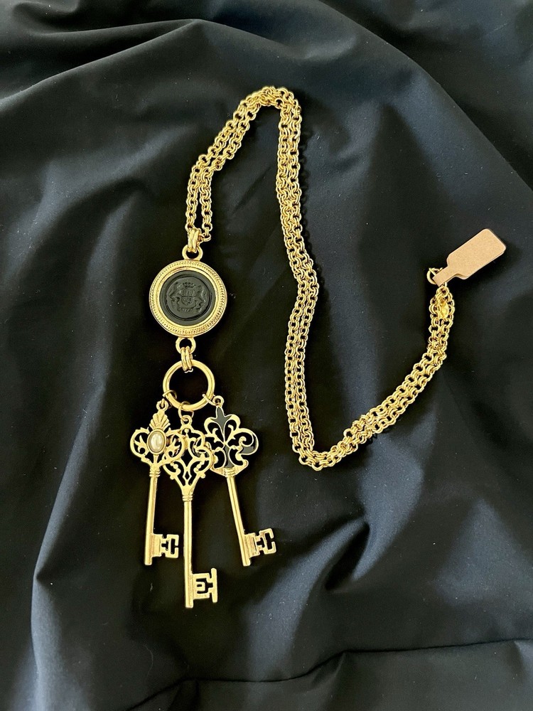 Joan Rivers Signed Gold Tone Black Intaglio Pendant Necklace with Dangling Key Charms