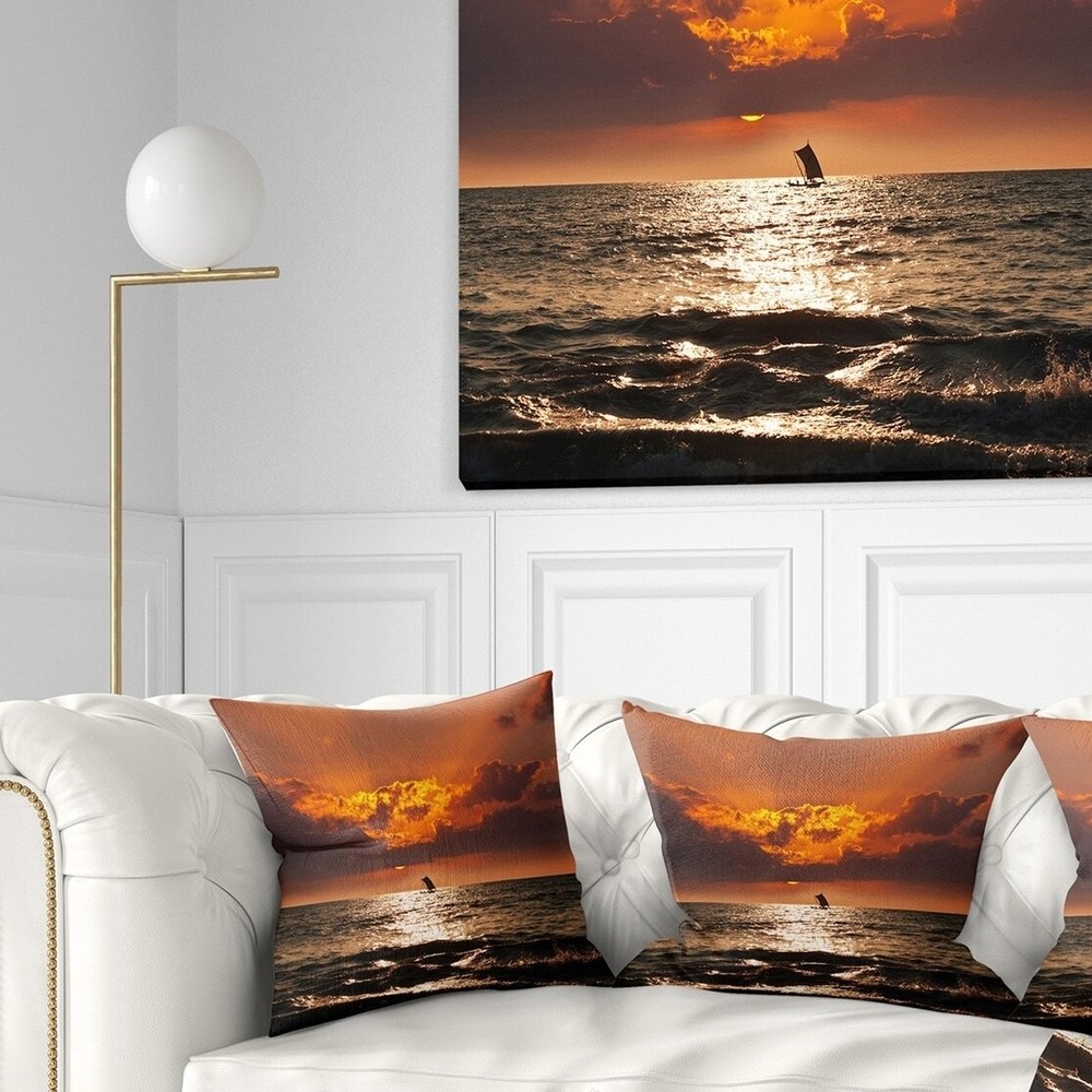 Designart 'Sunset Beach with Distant Sail Boat' Seashore
