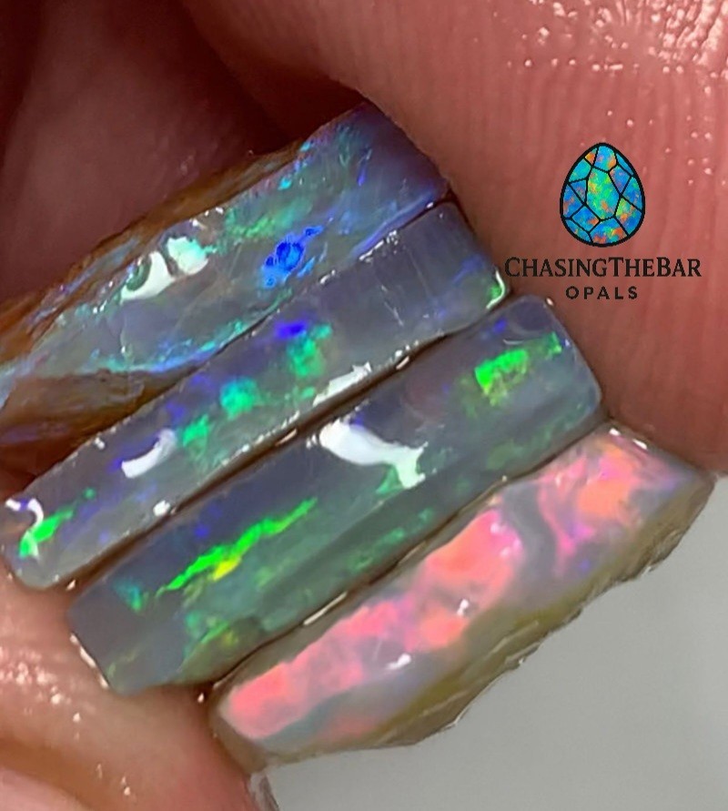 Stack of Super Bright Dark Mintabie Rough Opals to Cut. Australian Opal