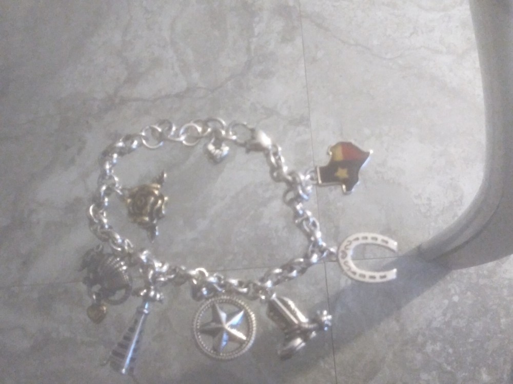 Brighton charm bracelet with customizable charms for stylish layering