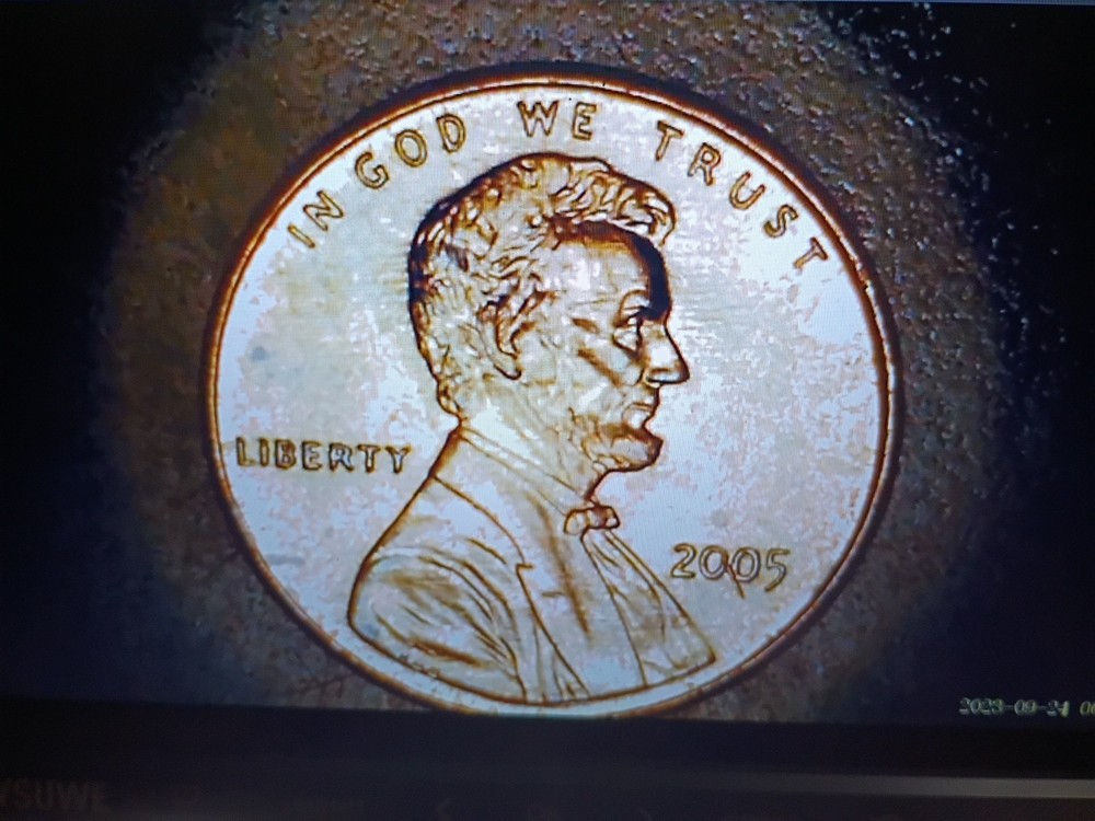 2005 Lincoln Mem. Cent Obv Struck Thru Debris. Exc. Red Coin . Great Eye Appeal.