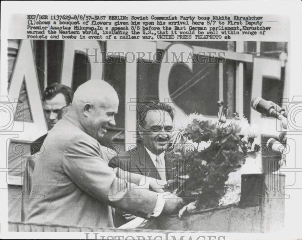 1957 Press Photo Nikita Khrushchev holding bouquet of flowers in East Berlin