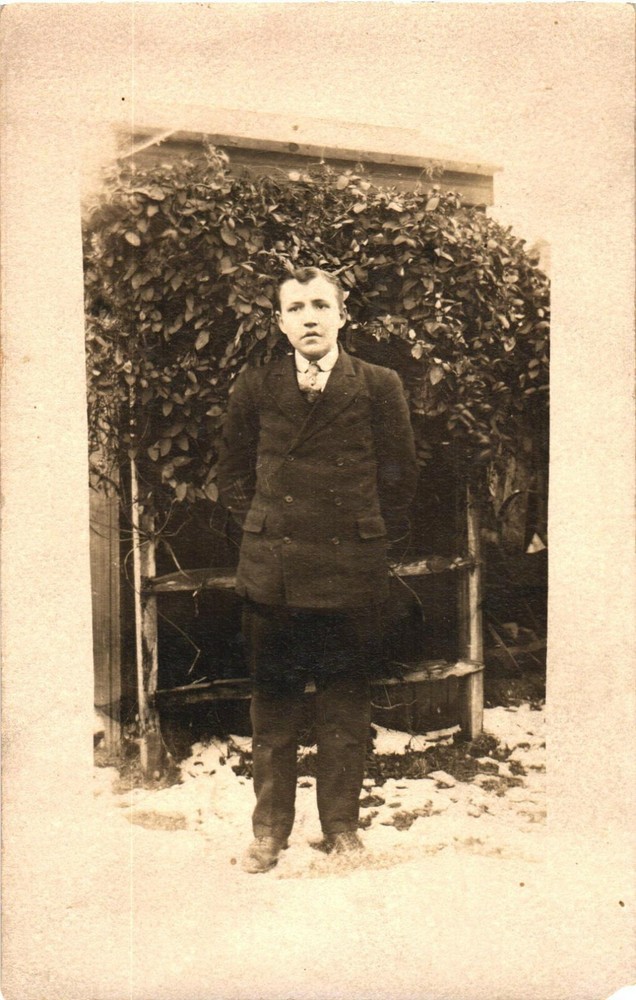 An Old Photo of A Man In His Black Suit Outdoors Postcard
