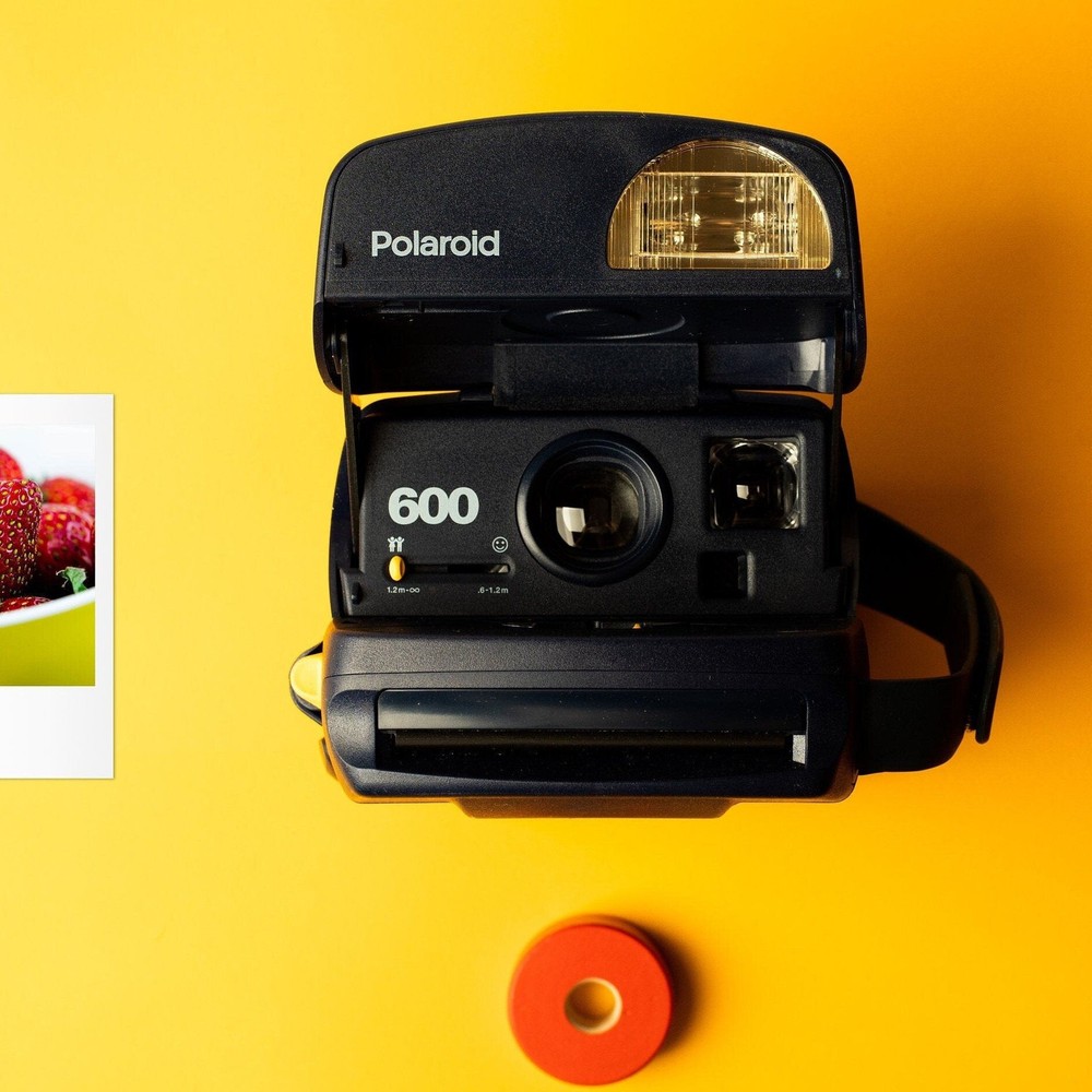 Vintage Polaroid 600 Round Instant Camera in Classic Blue Design