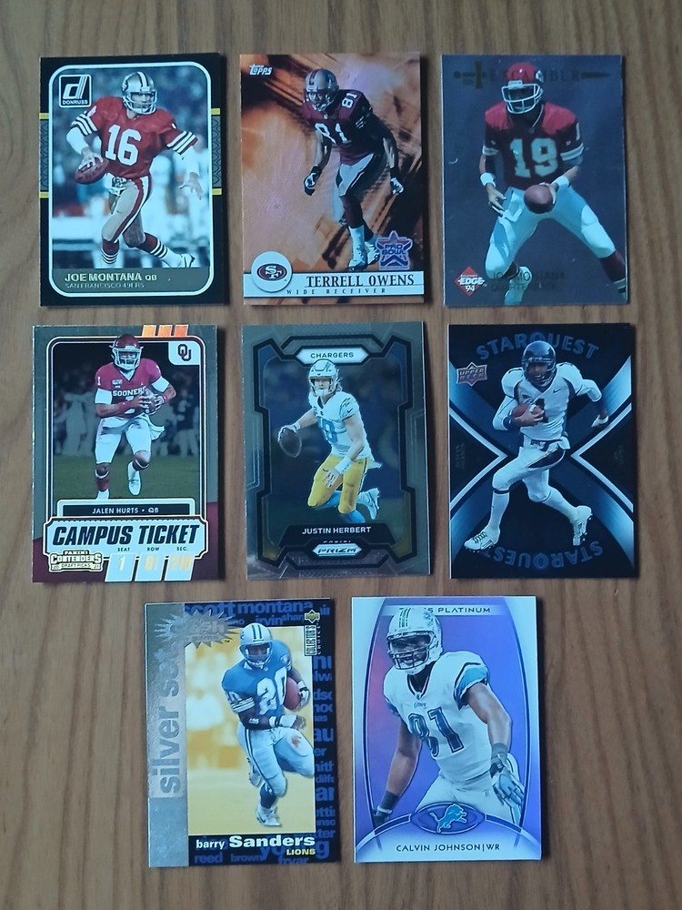 Lot of 8 - NFL Cards w INSERTS - JOE MONTANA JUSTIN HERBERT BARRY SANDERS HURTS