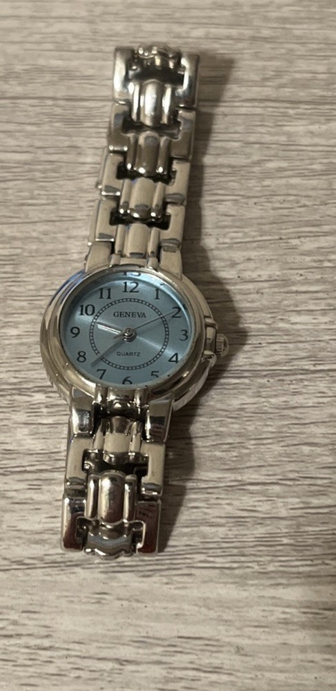 Shop geneva women's silver watch light blue face quartz movement. BROKEN CLASP.