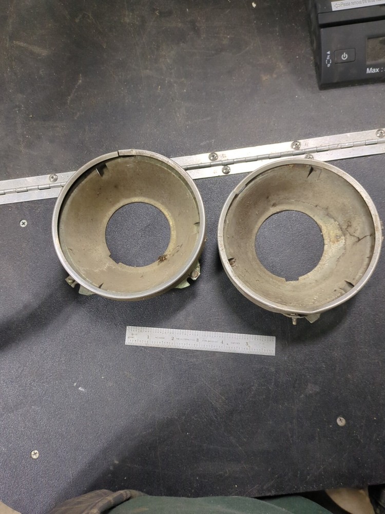Pair Of 1965-1966-1967 Pontiac GTO headlight buckets with retaining rings