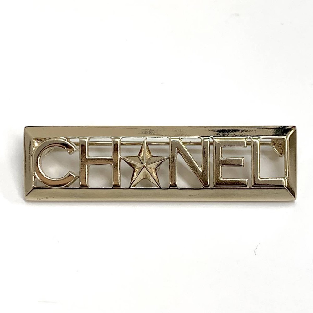 Chanel gold star brooch with iconic CC logo 6382