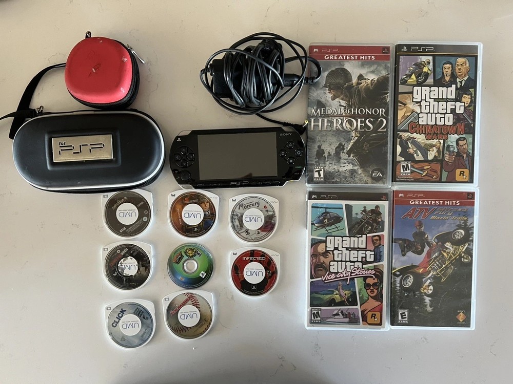 Sony PSP 1000 Bundle. 7 games. Movies and charger. READ DESCRIPTION.