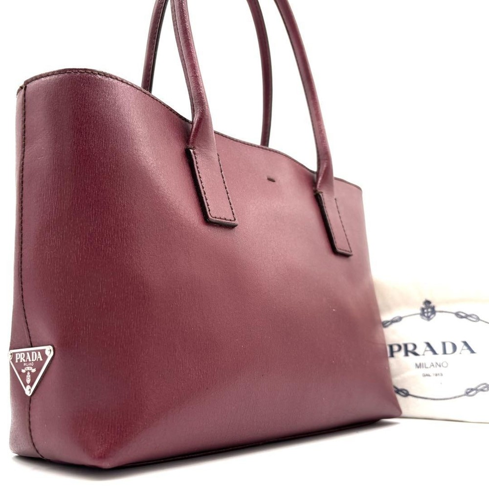 Prada Womens Bordeaux Leather Handbag with Triangle Logo White Tag