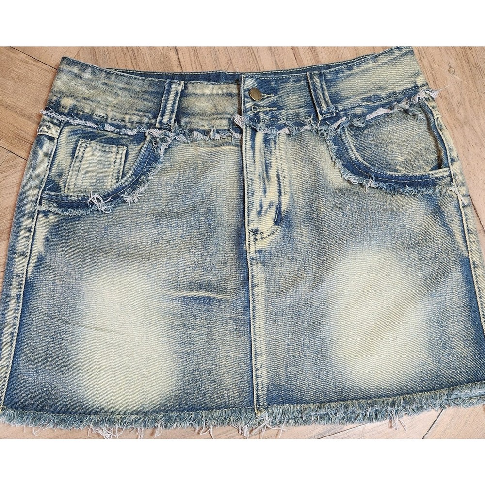 Fashion Nova distressed denim skirt in size Large for a trendy look