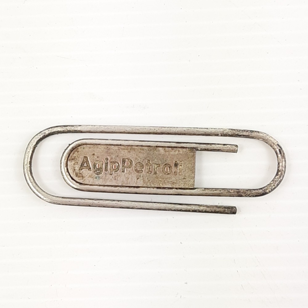 Vintage Agip petrol money clip featuring six-legged dog metal design