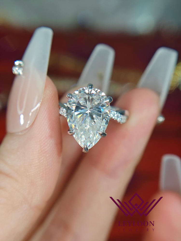 5 Carat Pear Cut Crushed Ice Moissanite Ring with Hidden Halo & Twisted Shank in 14K Gold