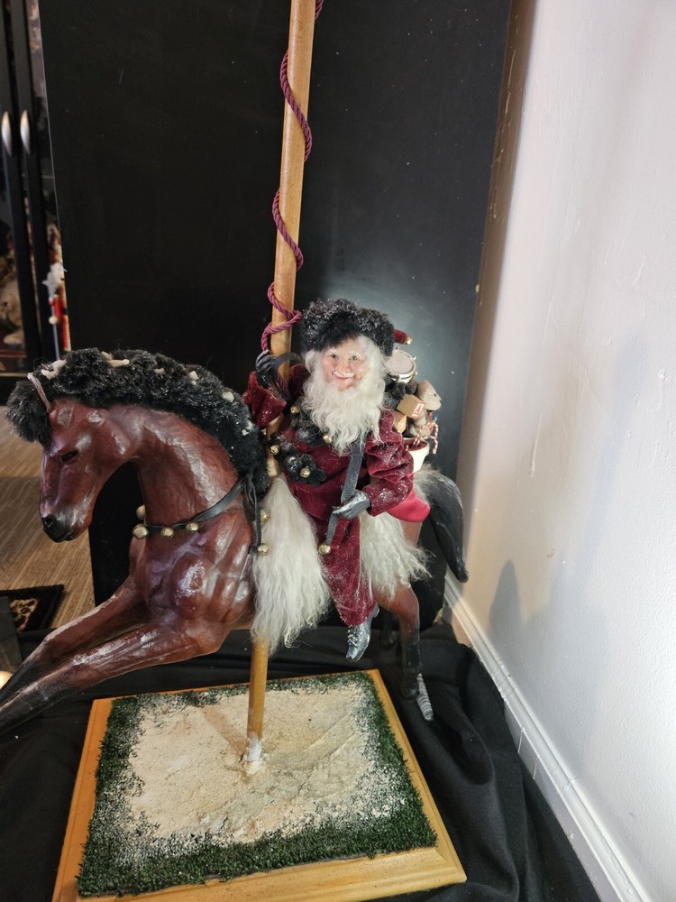Maria Saracino Hand Sculpted  Clay Father Christmas on leather horse (Carousell)