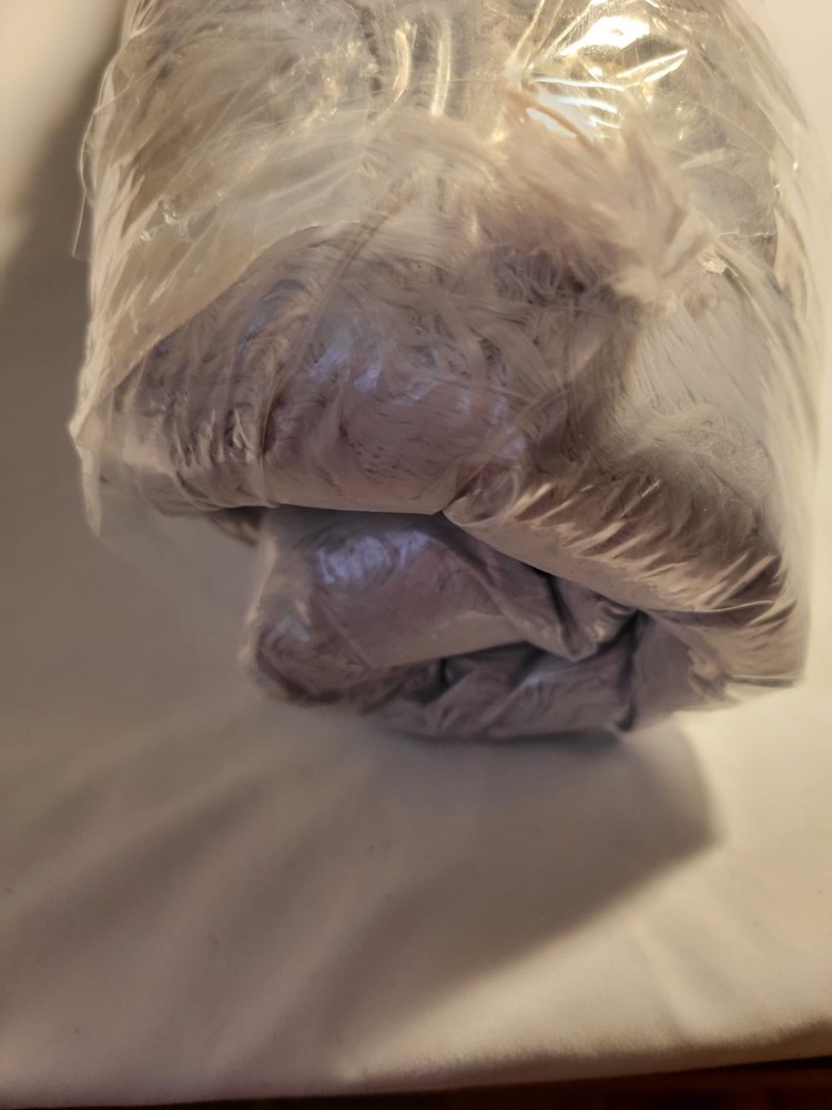 Cozy gray furry round dog bed for small pets