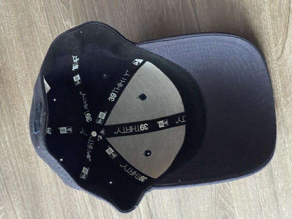 A Small/medium Dark Blue New Era Collectible Cap