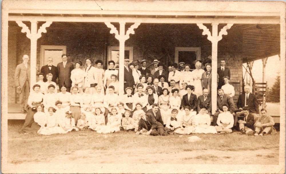 Large Group of People Sitting Outside a Store Front  Vintage RPPC Postcard 24087