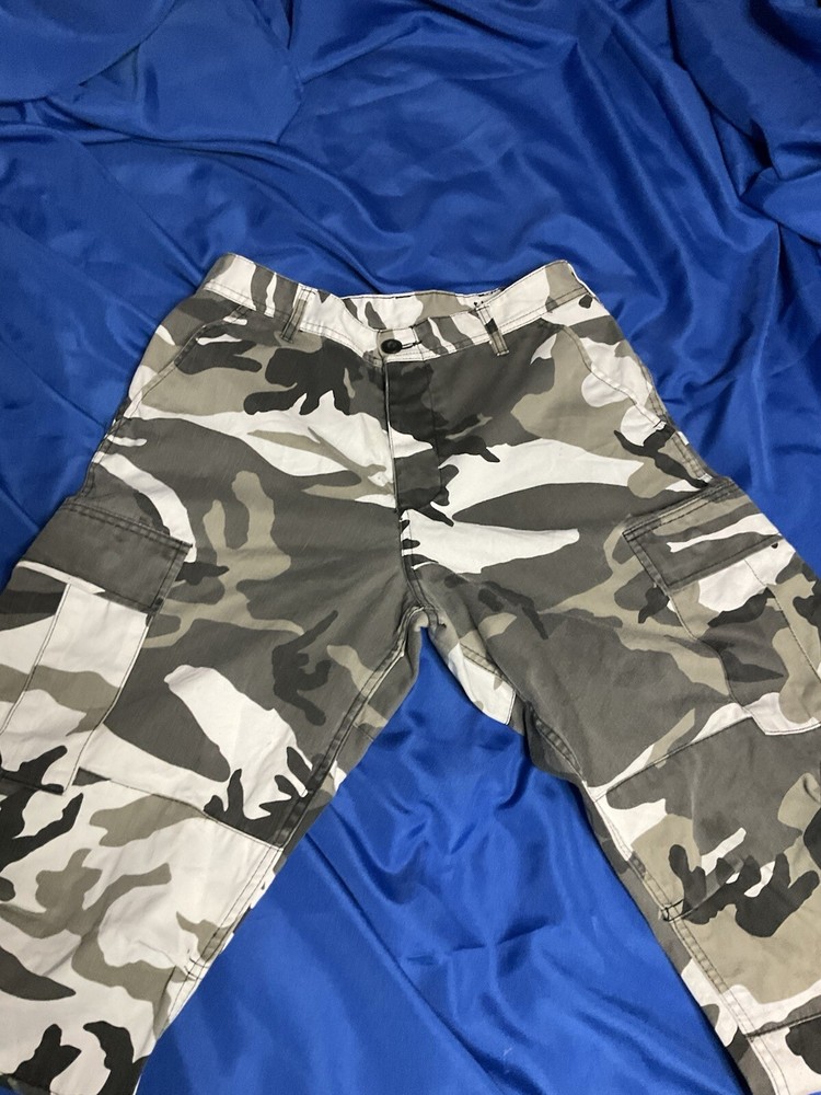 Grey camouflage cargo pants with multiple pockets for utility and style