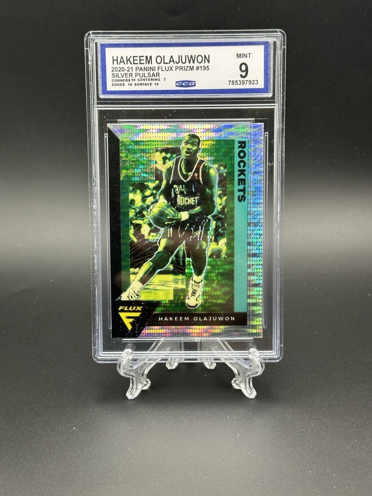2020-21 Panini Flux Silver Pulsar Hakeem Olajuwon #195 Rockets CCG 9 Mint