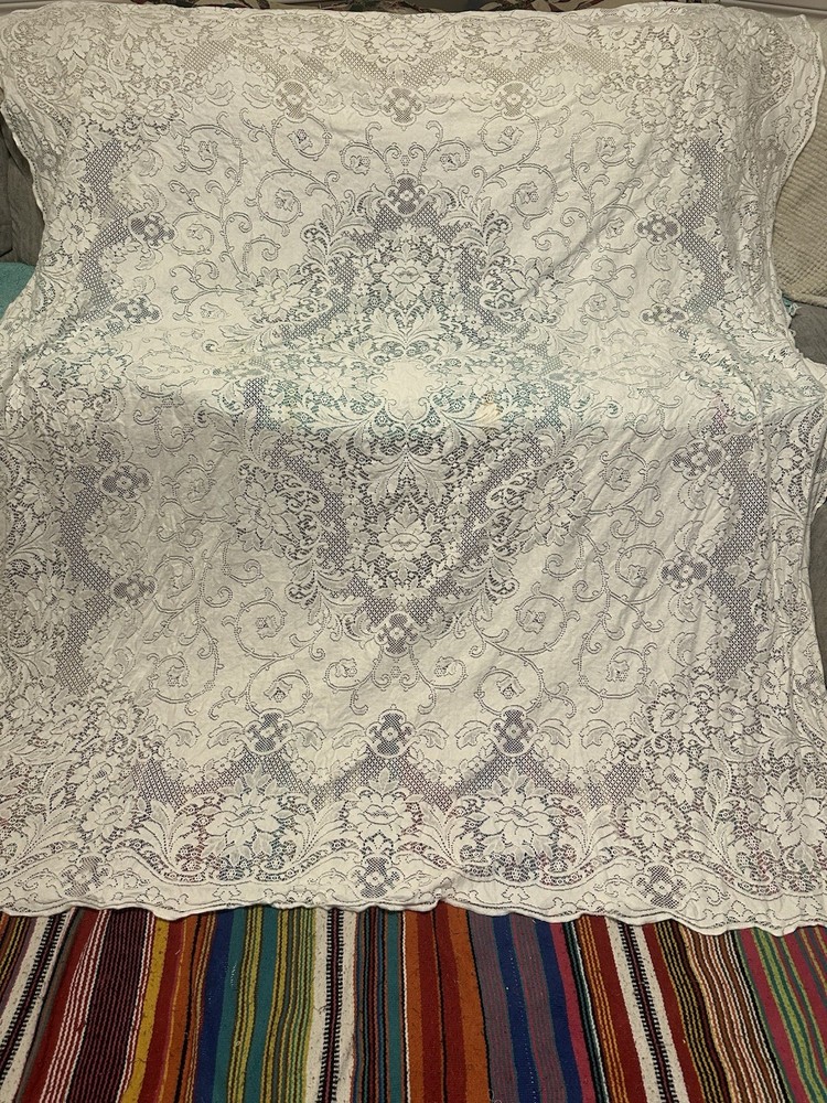 A vintage white floral lace tablecloth