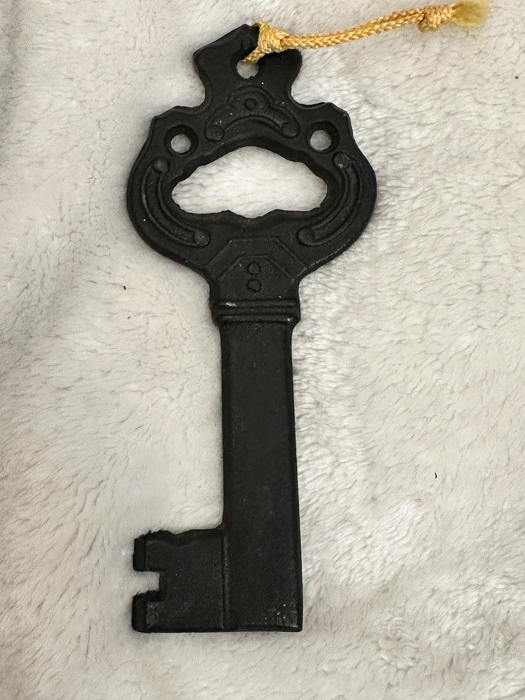 Vintage Cast Iron Bottle Opener with Key Design