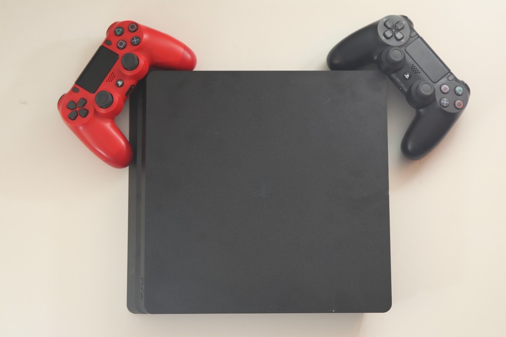 PlayStation 4 Slim Edition 1000 GB Black Console with 2 Controllers and 1 Game