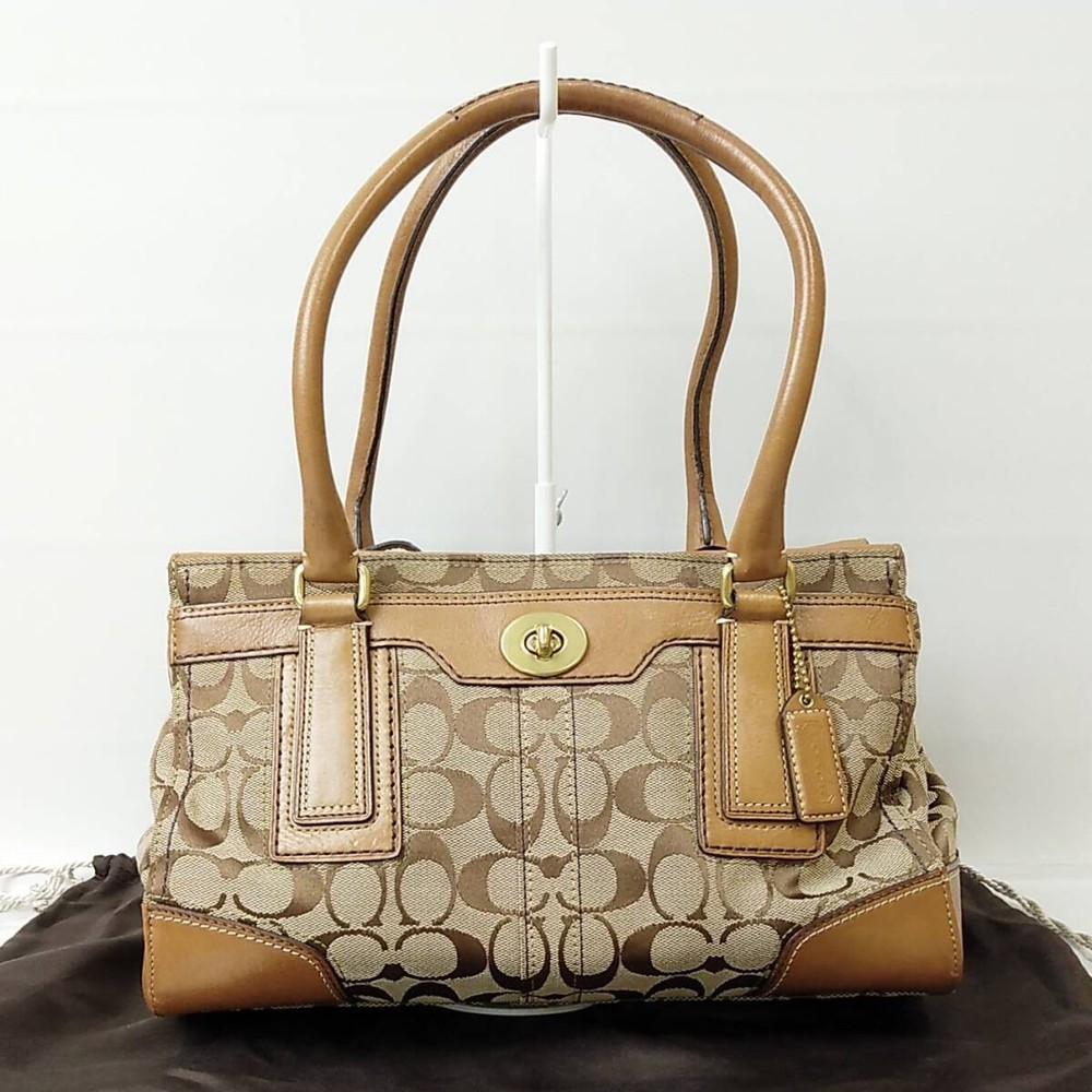 72B25 Coach Signature Brown Turn Lock Handbag