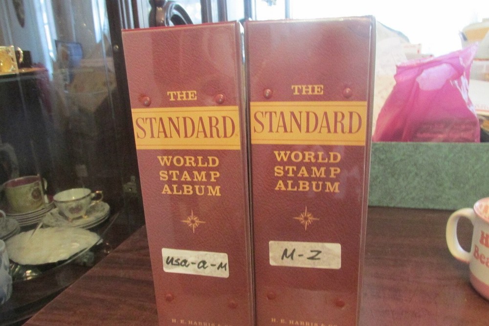 Lot of 2 Standard albums with a few stamps