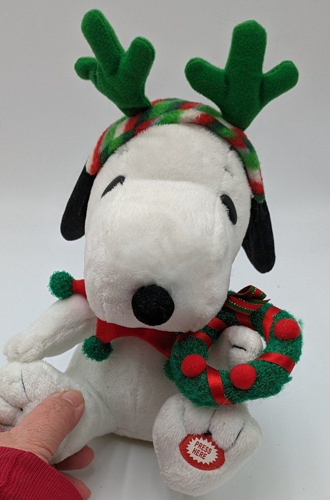 Musical Christmas Snoopy From Peanuts Wearing Antlers And Holding A Wreath
