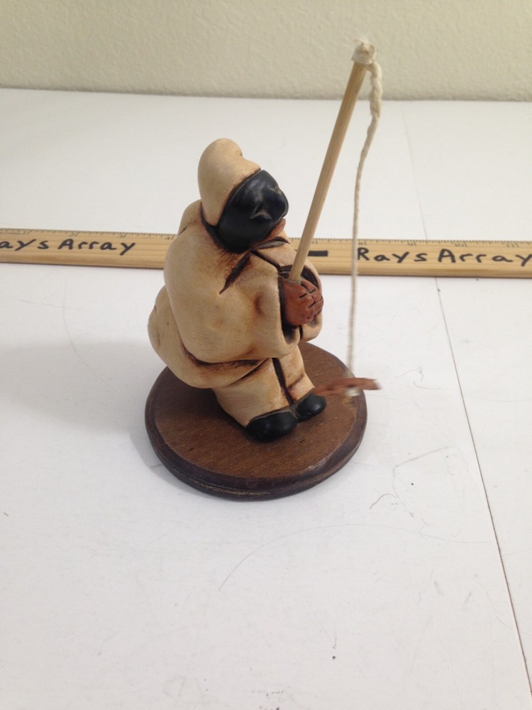 Porcelain sculpture fisherman black mask