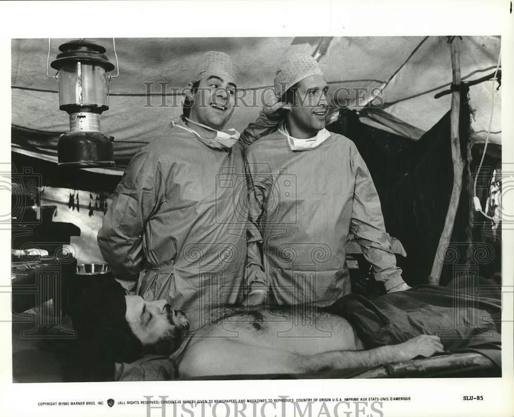 1985 Press Photo Dan Aykroyd) and Chevy Chase star in 