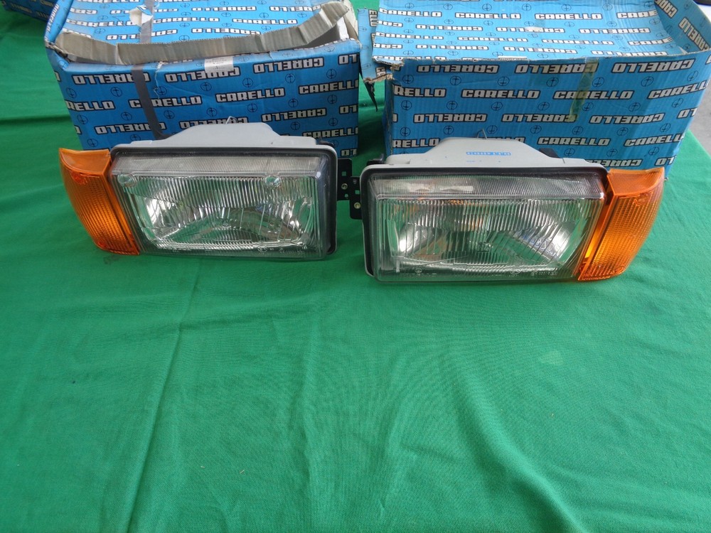 ALFA ROMEO GIULIETTA 116 PAIR OF TROLLEY HEADLIGHTS NEW ORIGINAL ORANGE ARROWS