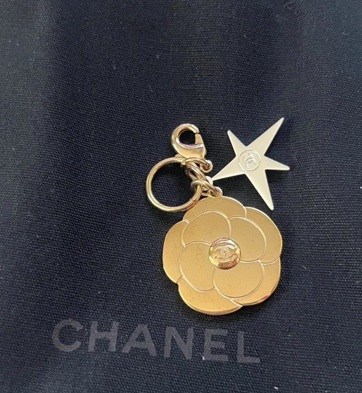 CHANEL Holiday 2025 Camelia Gold & Small Camellia Comet Charm With Black Bag