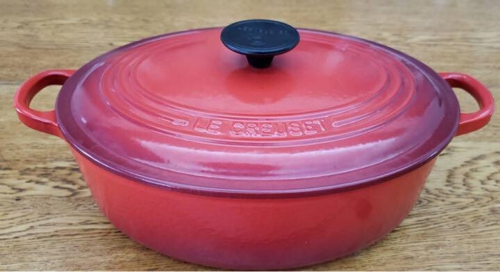 Le Creuset 27cm Red Enameled Oval Dutch Oven for Versatile Cooking
