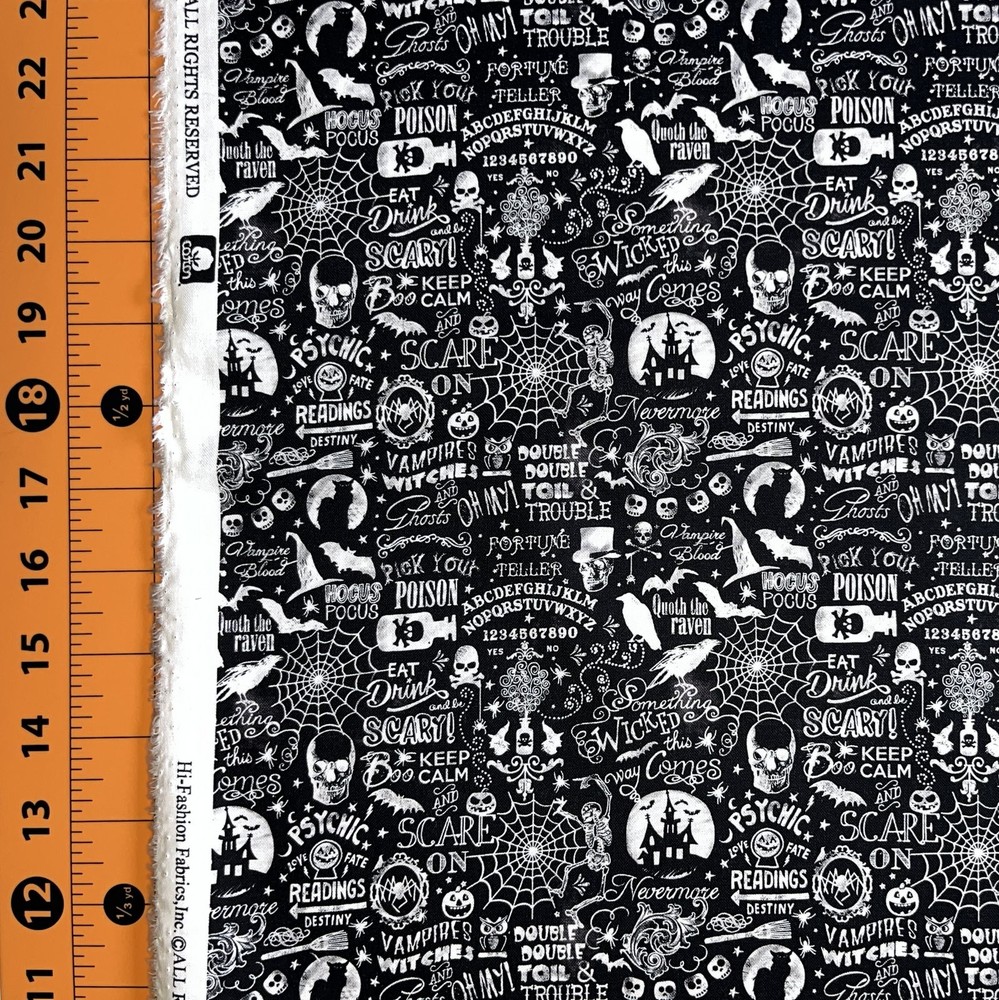 Halloween fabric with black and white spiderweb skull patch hi-fashion yardage