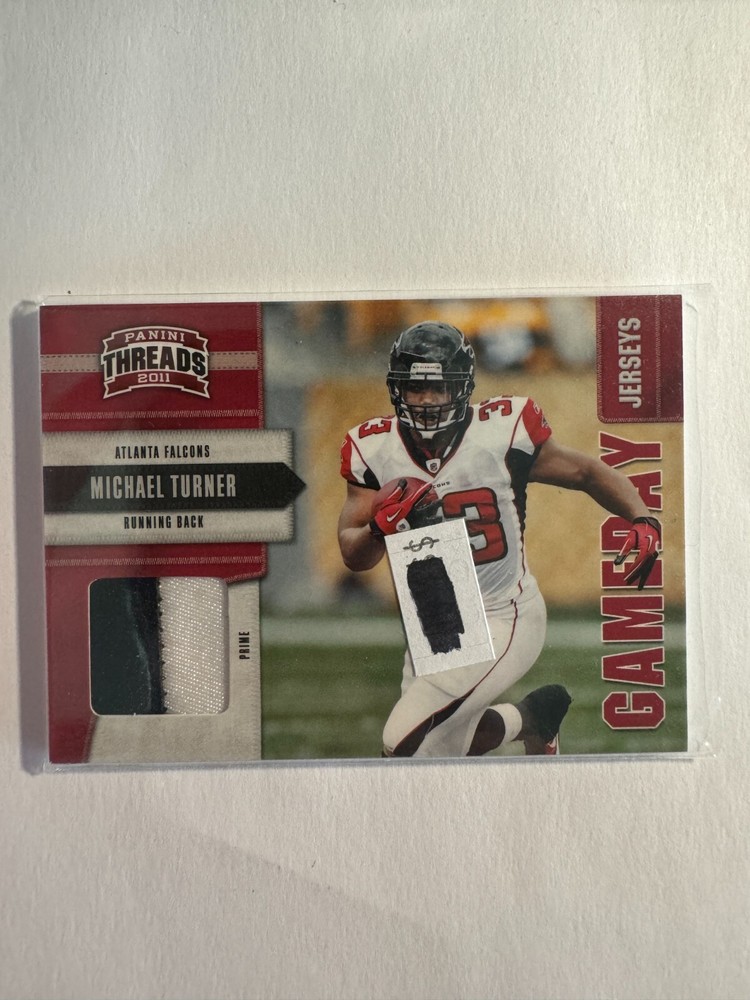 K221,389 - 2011 Panini Threads Game Day Jerseys Prime #19 Michael Turner #/50-image
