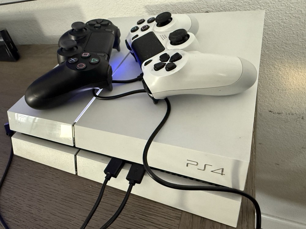 Sony PS4 with 2 DualShock 4 Controllers in Excellent Condition